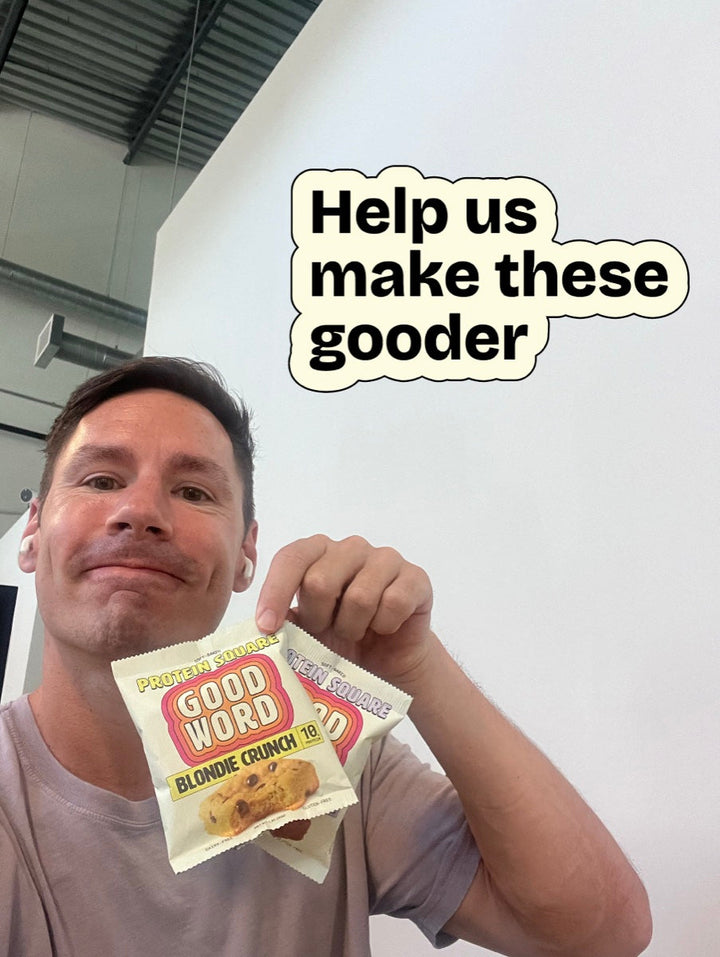 A customer holding a Good Word Protein Square