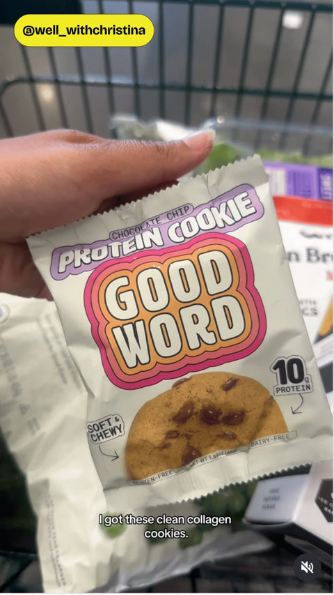 Customer holding a Good Word Chocolate Chip Protein Cookie